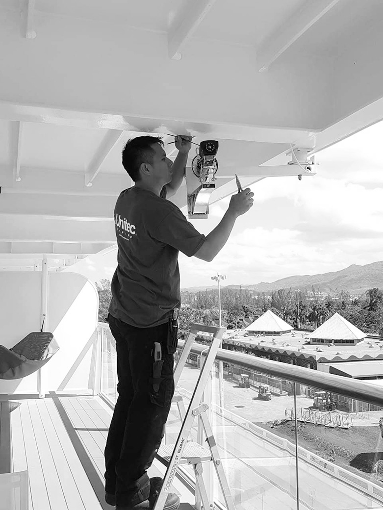 unitec marine worker installing on balcony