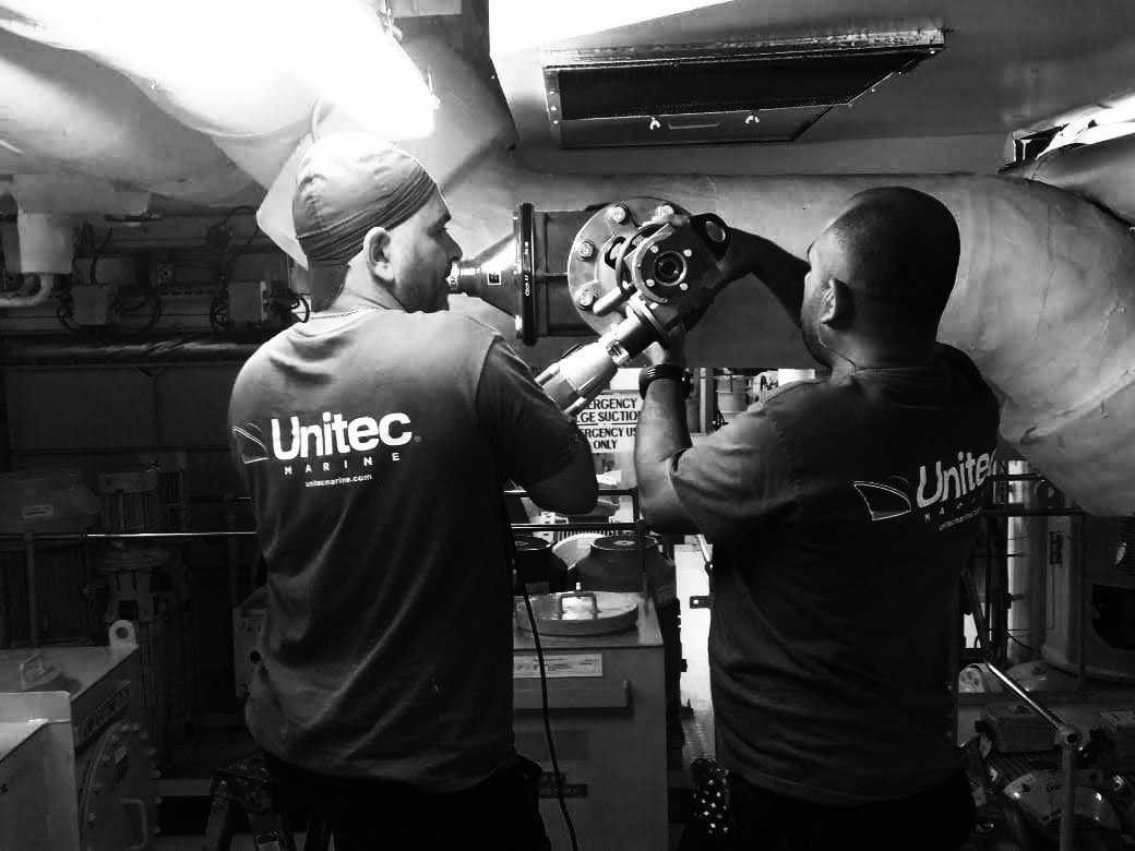two unitec marine employees working